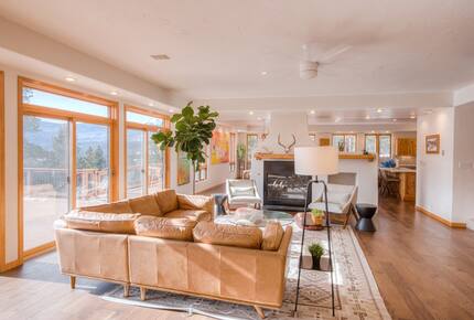 Home exchange in La Veta CO, living room with floor to ceiling windows