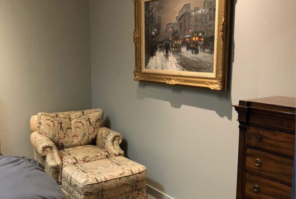 Home exchange in Portland, OR, guest bedroom with arm chair & ottoman