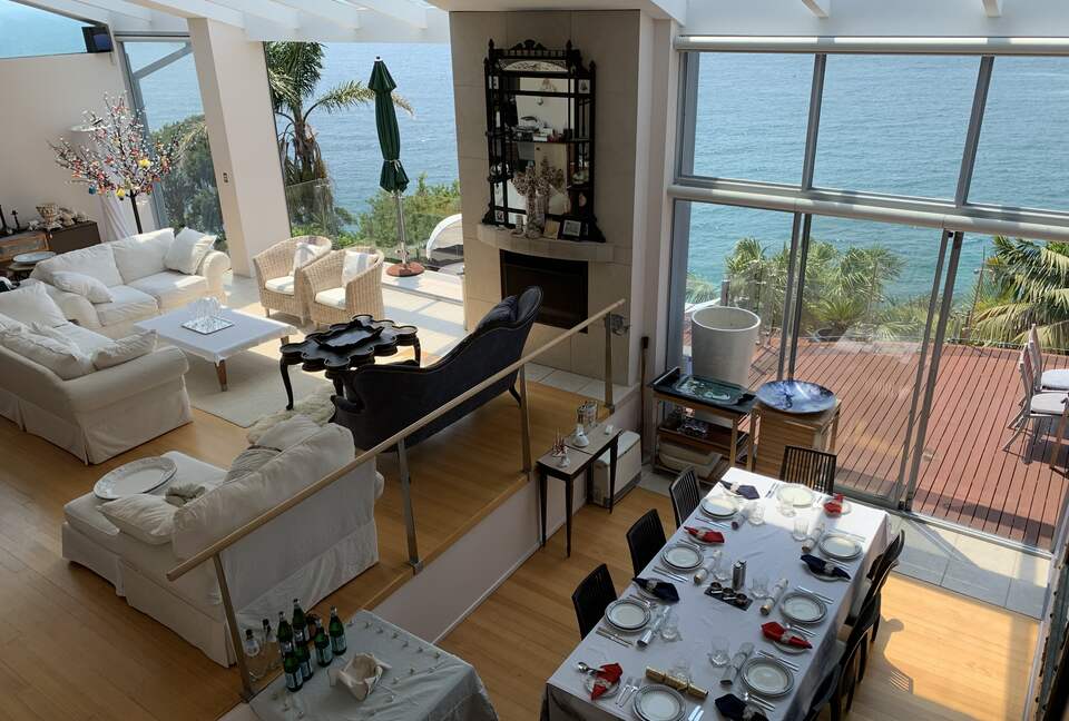 Open plan living and dining area opening onto spacious deck