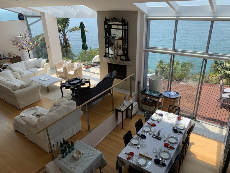 Open plan living and dining area opening onto spacious deck