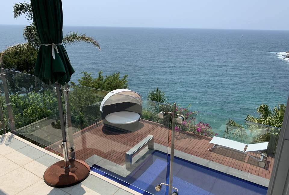 Your private plunge pool and lounging deck just steps below.