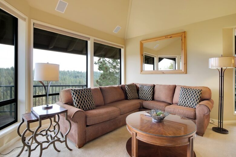 Home exchange in Bend, OR living room with sectional and windows