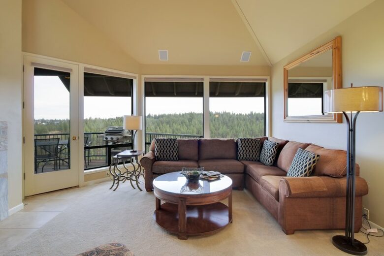 Home exchange in Bend, OR living room with sectional and windows
