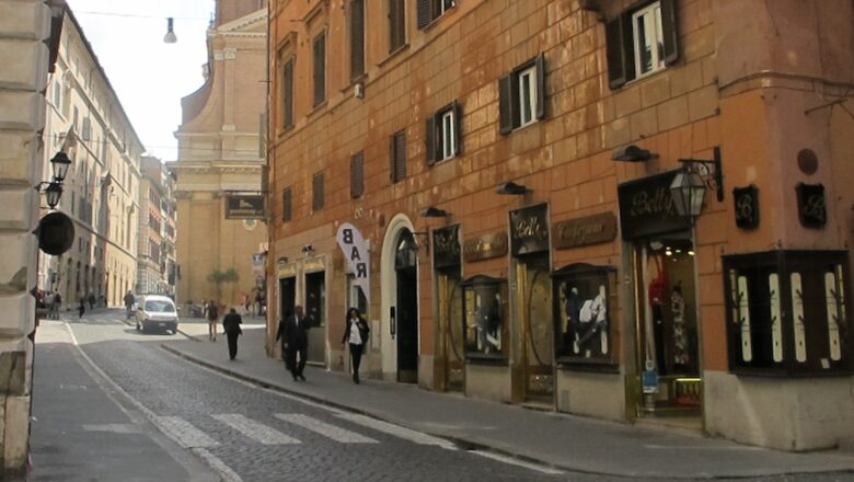 Our street, with wide sidewalks, bars, cafes, a local church