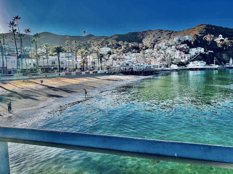 Home exchange in Avalon, CA, view of beachfront with mountains in back