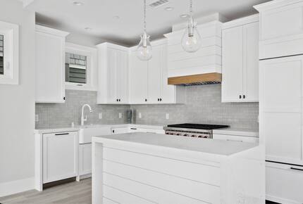 Home exchange in Newport Beach CA, all white kitchen with island