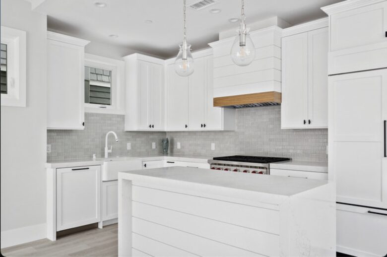 Home exchange in Newport Beach CA, all white kitchen with island