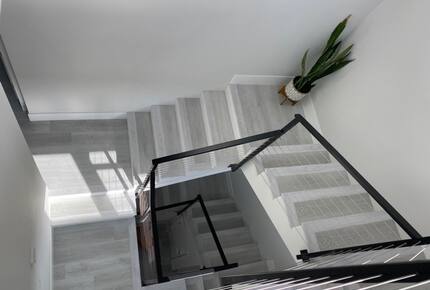 Home exchange in Newport Beach CA, staircase with black railings