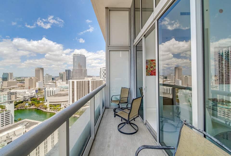 Home exchange in Miami FL, balcony with chairs overlooking the city