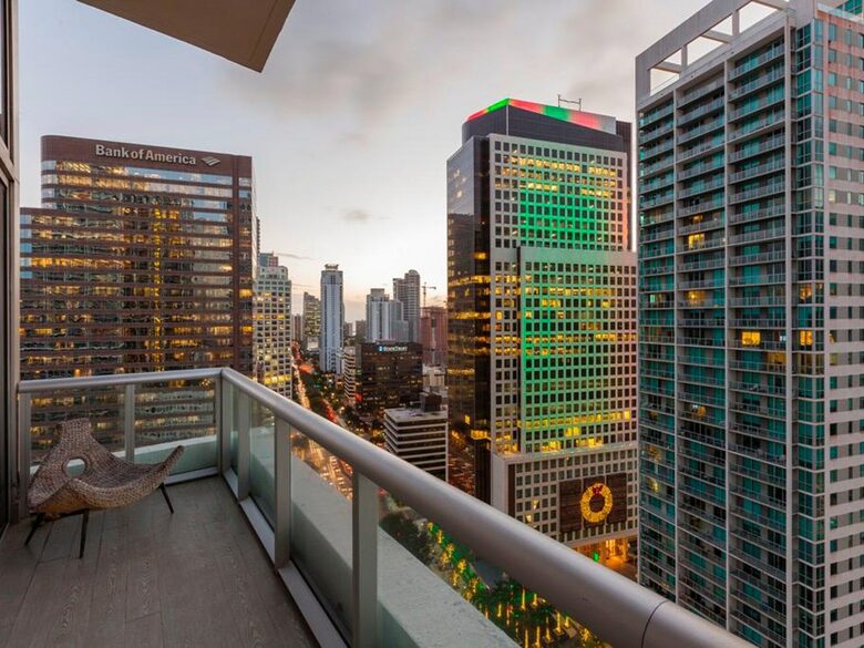 Home exchange in Miami FL, balcony overlooking the city at sunset