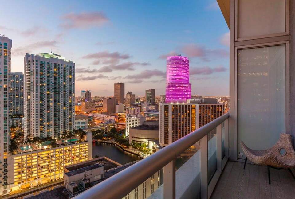 Home exchange in Miami FL, balcony overlooking the city at sunset