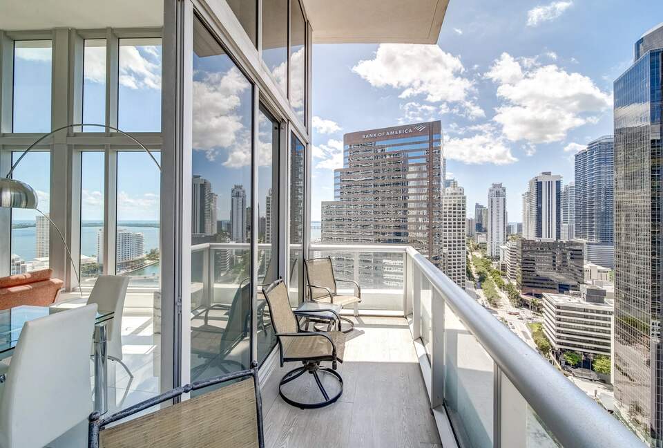 Home exchange in Miami FL, balcony with chairs overlooking the city
