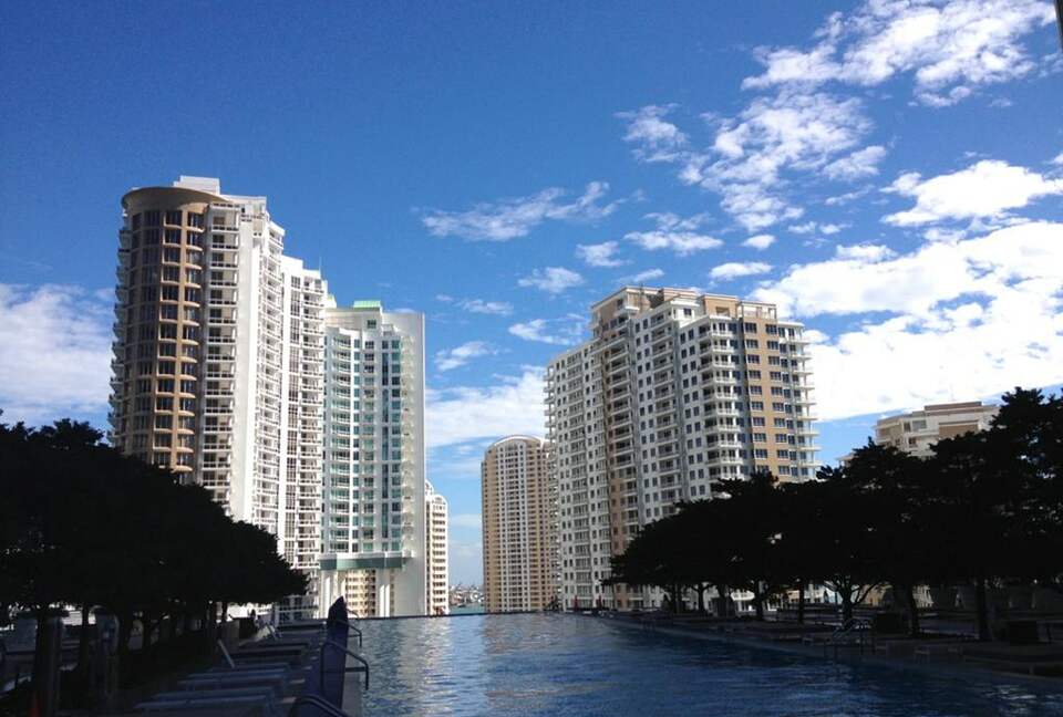 Home exchange in Miami FL, view of terrace pool and city buildings