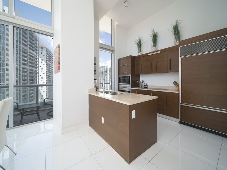 Home exchange in Miami FL, kitchen with brown cabinetry