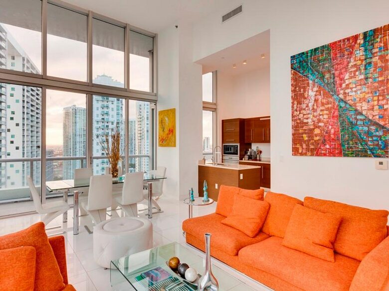 Home exchange in Miami FL, living room with orange couch