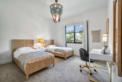 Bedroom with two Full sized beds and desk area