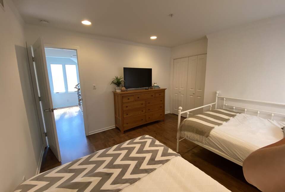 2nd Floor Bedroom with 2 double beds, TV & adjacent bathroom