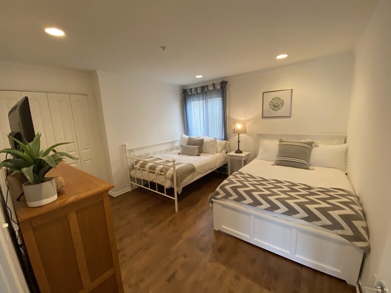 2nd Floor Bedroom with 2 double beds, TV & adjacent bathroom