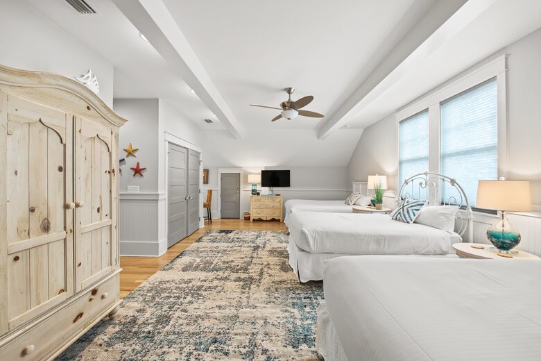 Home exchange in WaterSound FL, second floor bedroom with 3 queen beds