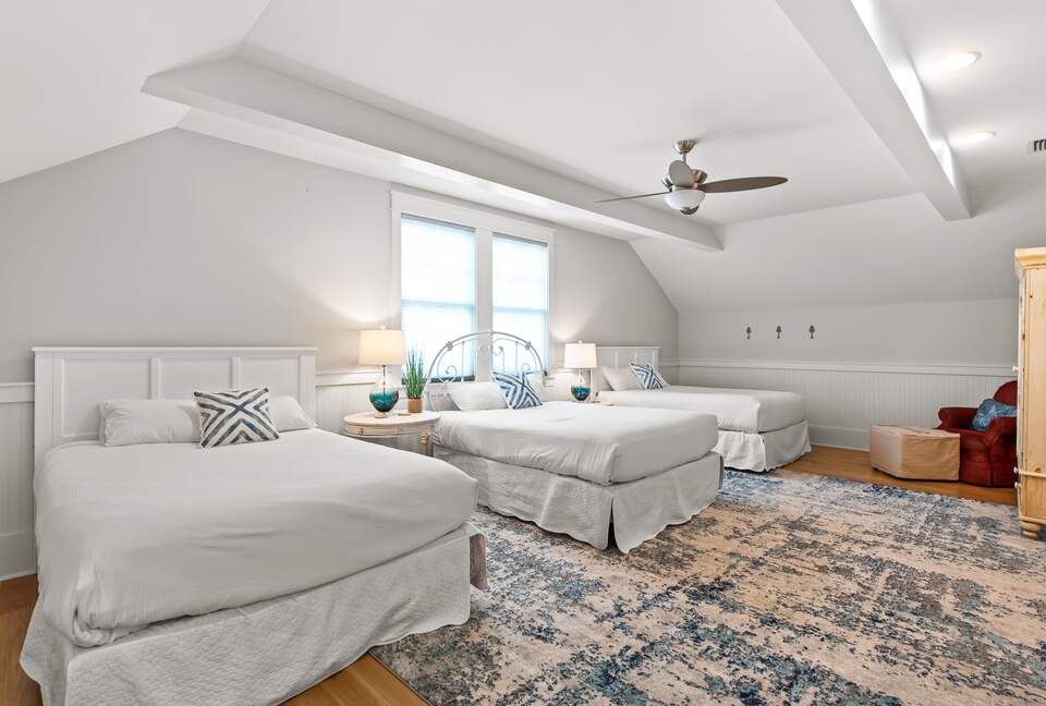 Home exchange in WaterSound FL, second floor bedroom with 3 queen beds