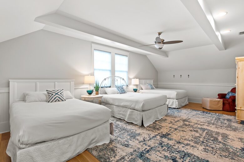 Home exchange in WaterSound FL, second floor bedroom with 3 queen beds