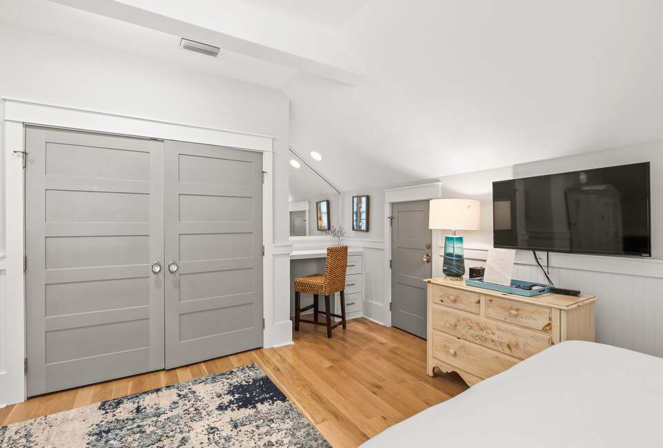 Home exchange in WaterSound FL, second floor bedroom with TV and desk