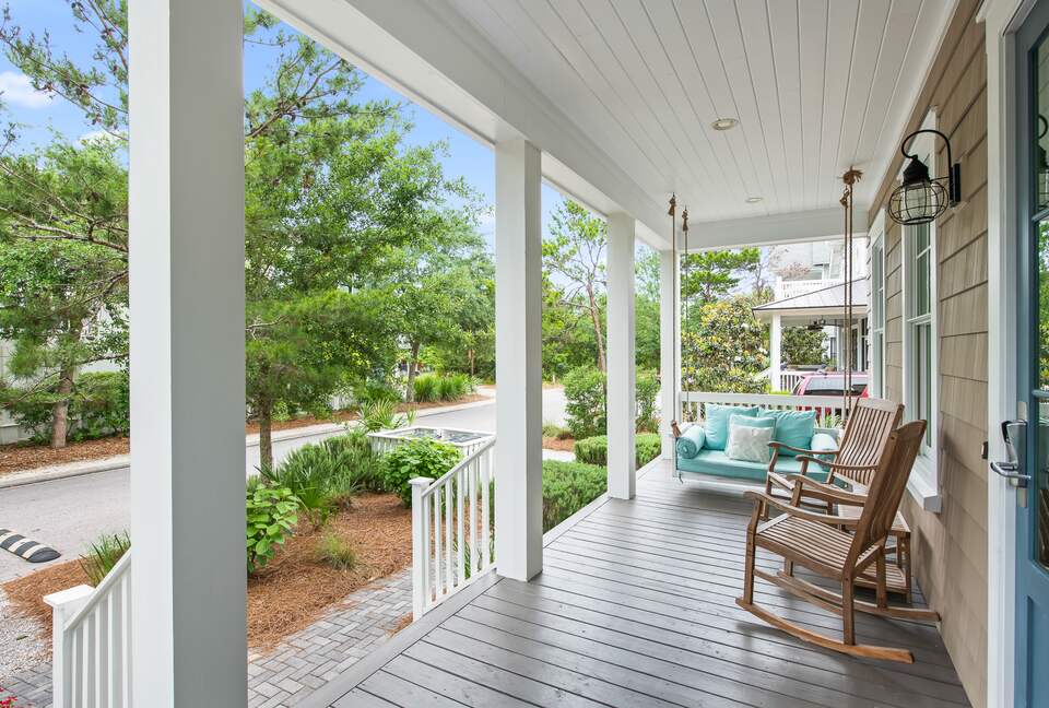 Home exchange in WaterSound FL, front porch with swing & rocking chair