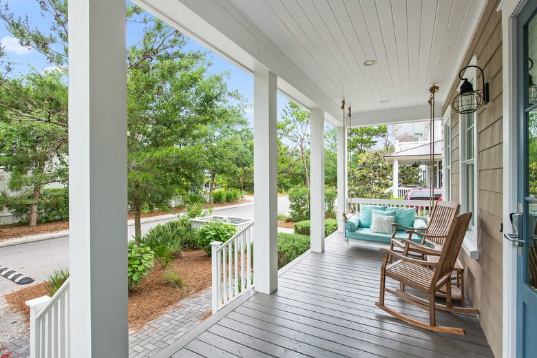 Home exchange in WaterSound FL, front porch with swing & rocking chair