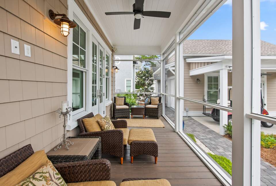 Home exchange in WaterSound FL, screened in porch with seating & fan
