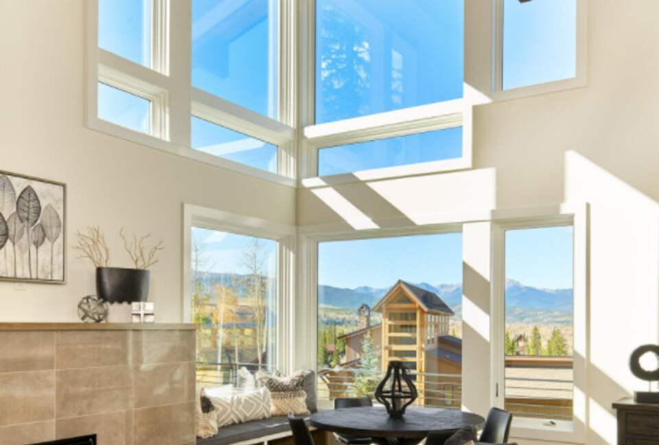 Home exchange in Fraser CO, living room with tall ceilings and windows