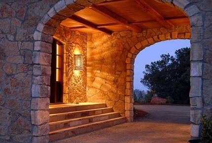 Home exchange in Calistoga CA, arched entryway illuminated at night