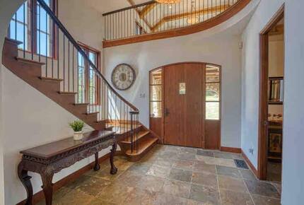 Home exchange in Calistoga CA, interior entryway with grand staircase