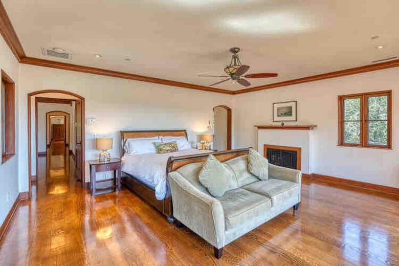 Home exchange in Calistoga CA, master suite with fireplace and sofa