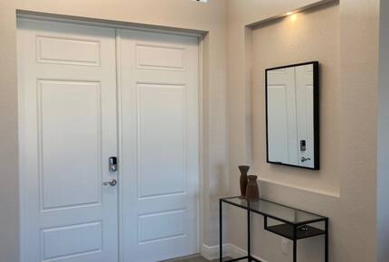 Home exchange in Cape Coral FL, entryway with decor & white doors