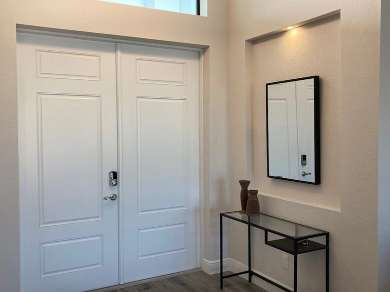 Home exchange in Cape Coral FL, entryway with decor & white doors