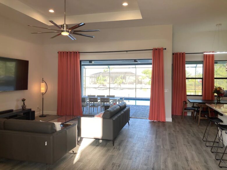 Home exchange in Cape Coral FL, living room with 2 sofas & door