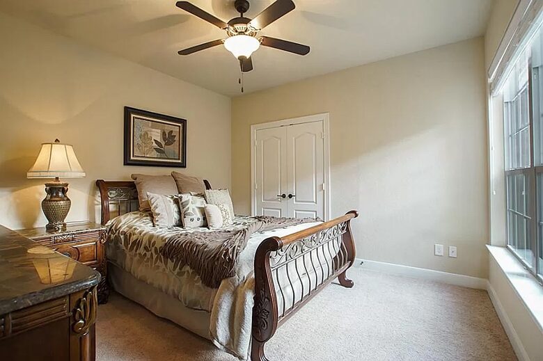 Home exchange in Woodlands TX, first floor bedroom with a queen bed