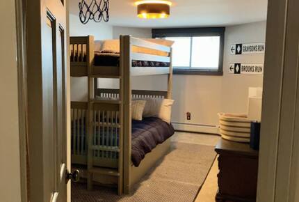 Home exchange in Jay Peak VT, lower level bedroom with one full bunk