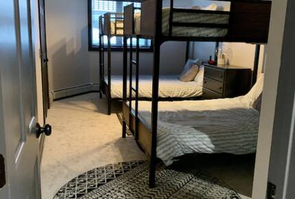 Home exchange in Jay Peak VT, lower level bedroom with 2 full bunks