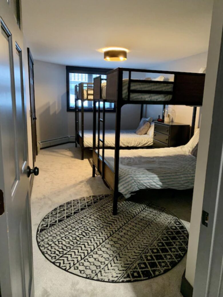 Home exchange in Jay Peak VT, lower level bedroom with 2 full bunks