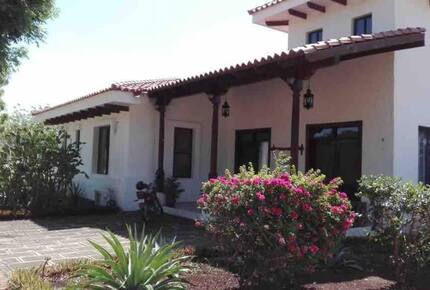 Home exchange at Gran Pacifica, front entrance with flower bushes