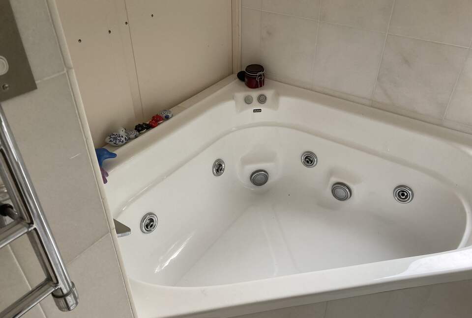 Relaxing spa in marbled master bathroom