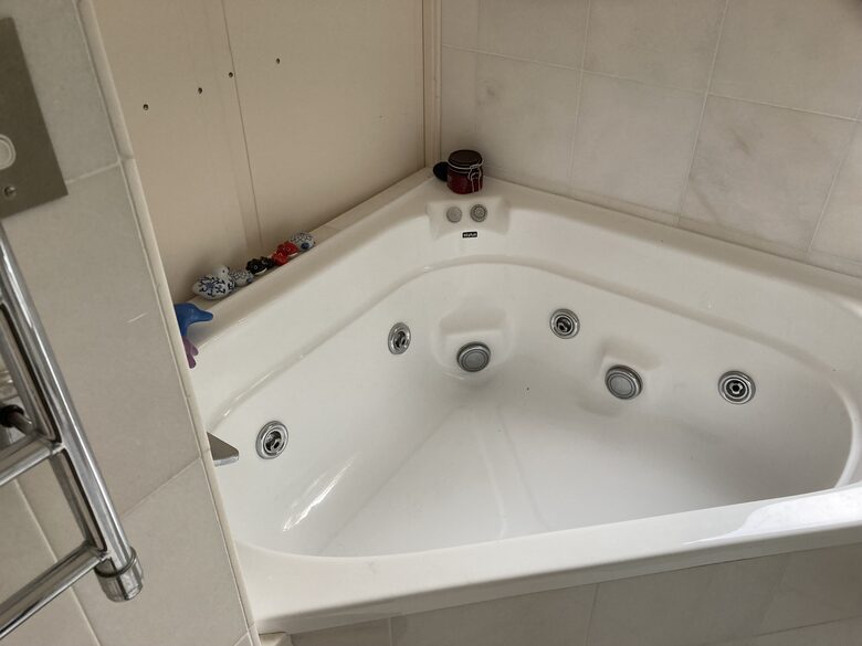 Relaxing spa in marbled master bathroom