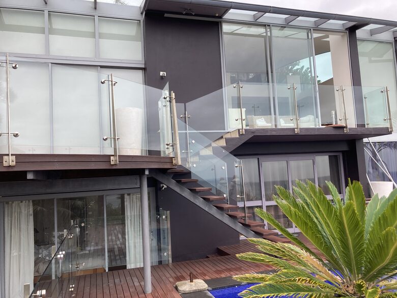 View of home exterior from simming pool deck