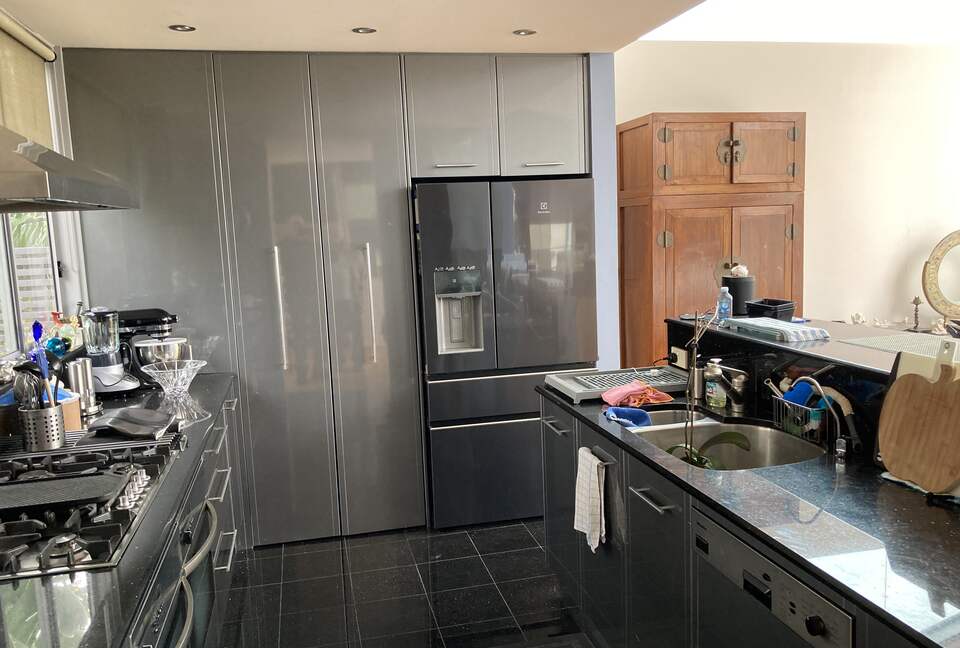 Home Exchange in Sydney open kitchen with Miele appliances