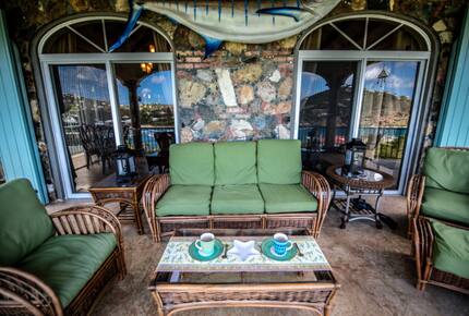 Home exchange in St John USVI, balcony with green seat cushions