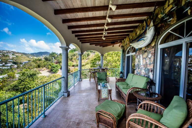 Home exchange in St John USVI, living area balcony with soft seating