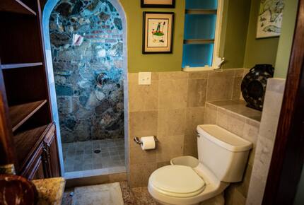 Home exchange in St John USVI, ensuite bath with stone wall shower