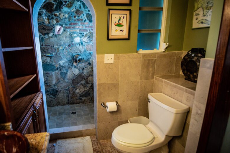 Home exchange in St John USVI, ensuite bath with stone wall shower