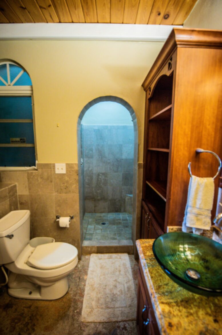 Home exchange in St John USVI, ensuite bath with stone wall shower